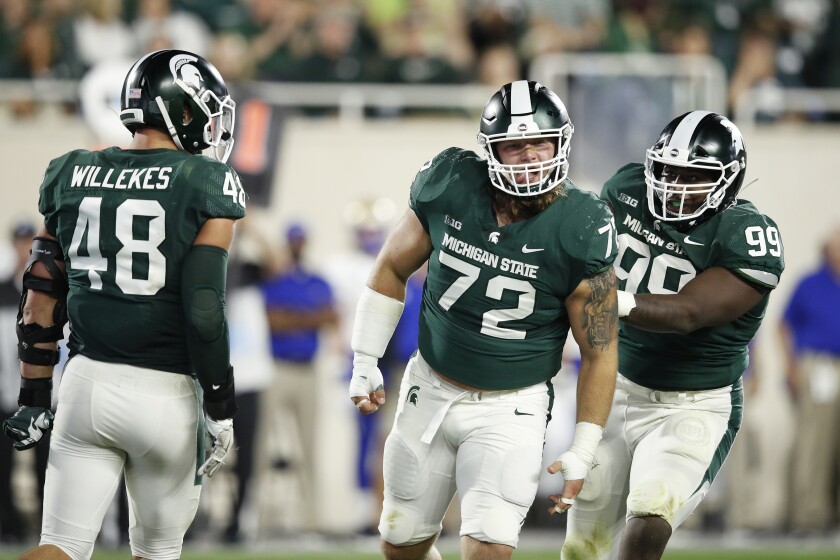 Michigan State's Mike Panasiuk (72) celebrates a tackle behind the line of scrimmage in a 28-7 win over Tulsa on Aug. 30.