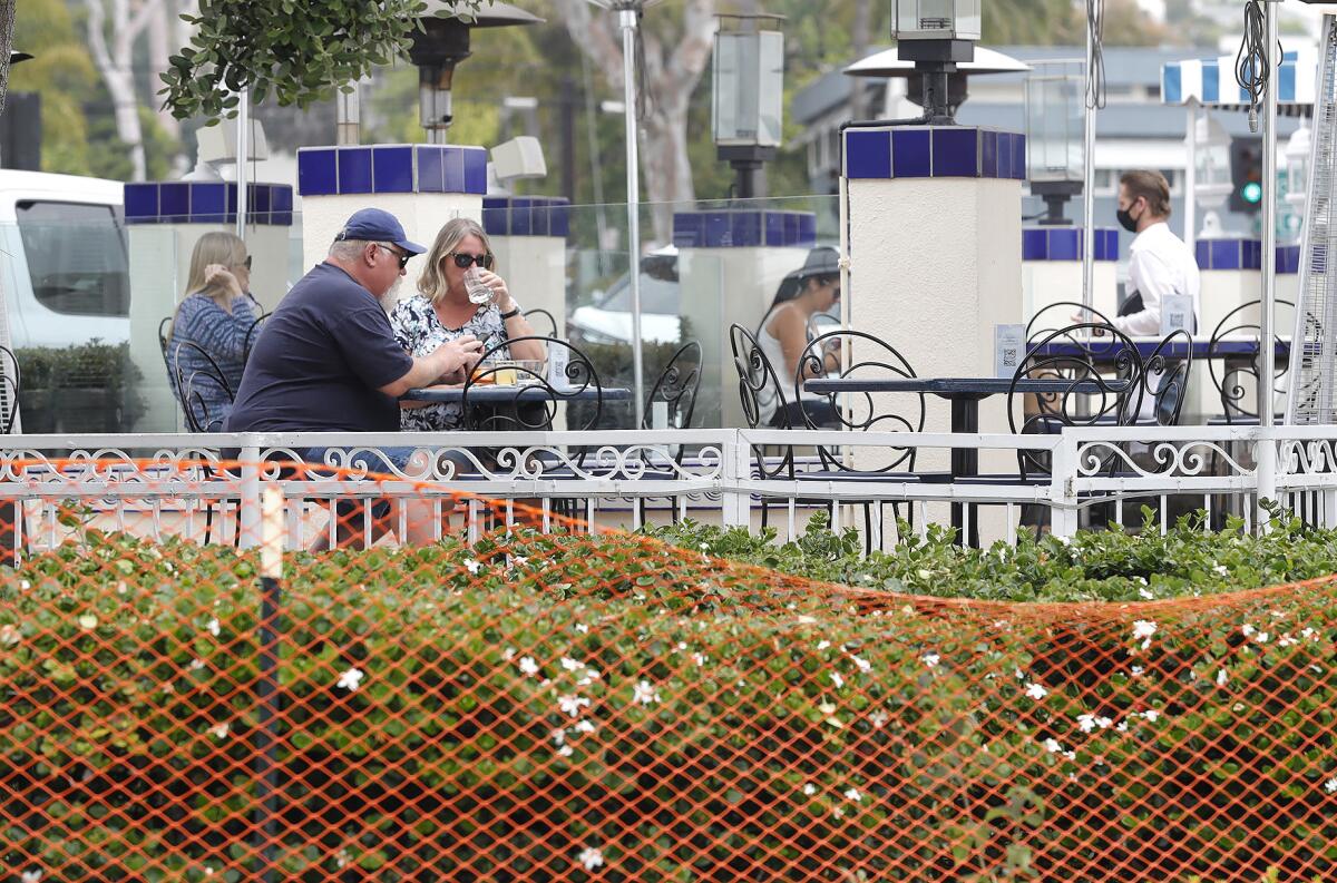 Patrons eat outside at Las Brisas in Laguna Beach on Tuesday.