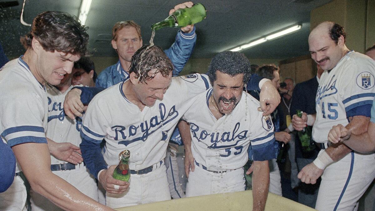 Kansas City Royals players, including George Brett, left center, celebrate their World Series win over the St. Louis Cardinals on Oct. 27, 1985.