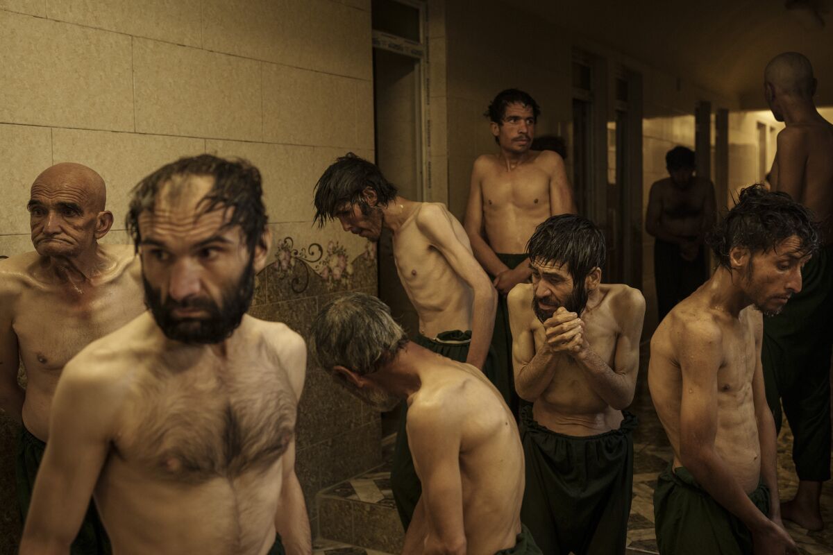 Drug users detained during a Taliban raid wait to be shaved after arriving at Avicenna Medical Hospital for Drug Treatment in Kabul, Afghanistan, on Oct. 1, 2021. (AP Photo/Felipe Dana)