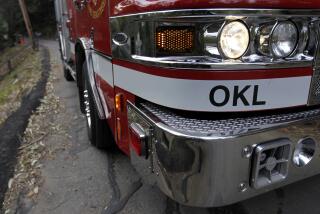 An Oakland Fire Department truck, specially outfitted for hilly roads, navigates a narrow section of Valley View Road, with about one-foot of clearance, in Oakland, Calif. on Tuesday, Nov. 26, 2013. Despite the lessons learned from the 1991 Oakland Hills Fire, some residents continue to park vehicles in narrow sections of the road, making it difficult for emergency responders to pass. (Photo By Paul Chinn/The San Francisco Chronicle via Getty Images)