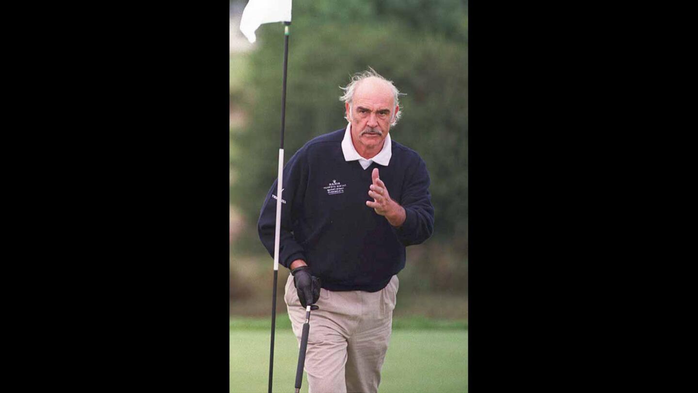 Connery indulges in his favorite off–screen pursuit at the Jackie Stewart Celebrity Challenge golf tournament in 2010.