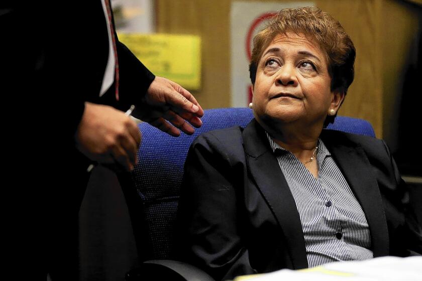 Former Bell City Councilwoman Teresa Jacobo listens while her attorney, Leo Moriarty, speaks on her behalf prior to her sentencing in Los Angeles County Superior Court.