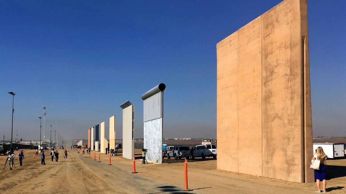 Prototypes of border walls in San Diego, seen in a file photo from October. President Trump plans to visit California in March and is likely to view the prototypes.