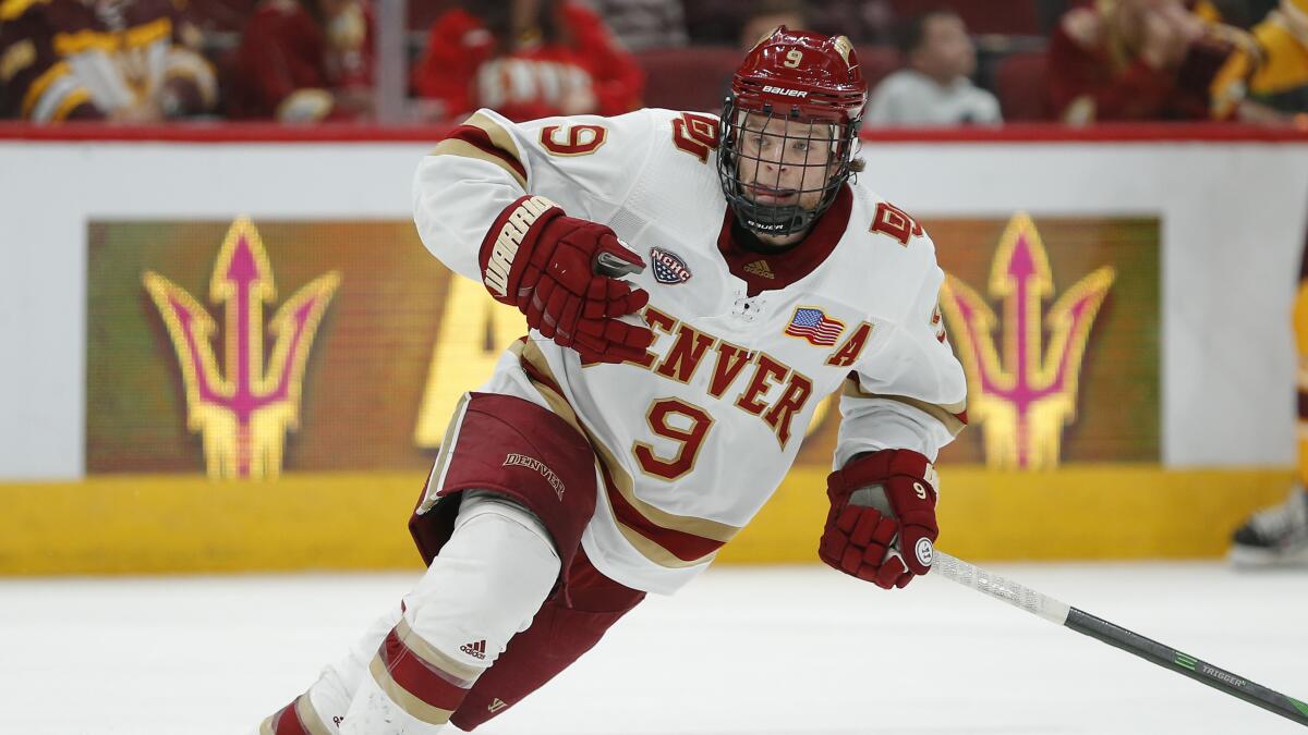 Denver forward Tyson McLellan chases the puck during a game against Arizona State on Dec. 7, 2019.