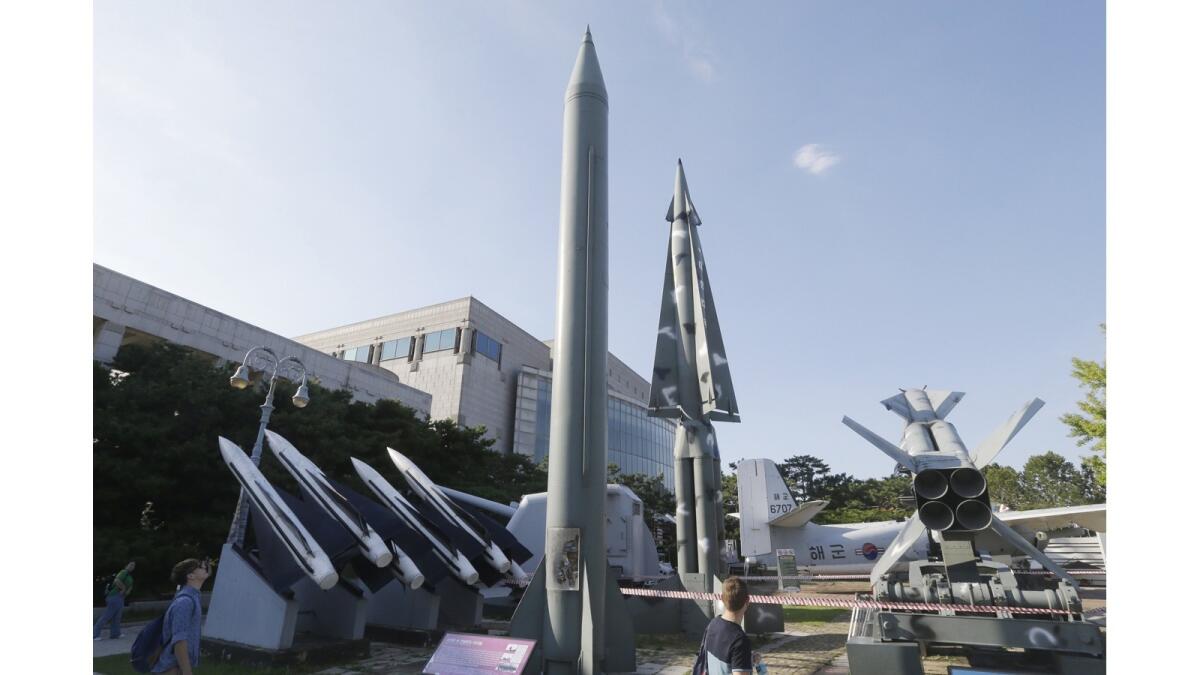Models of North and South Korean missiles are displayed outside a war museum in Seoul. Officials say there are no signs a North Korean missile launch is imminent.