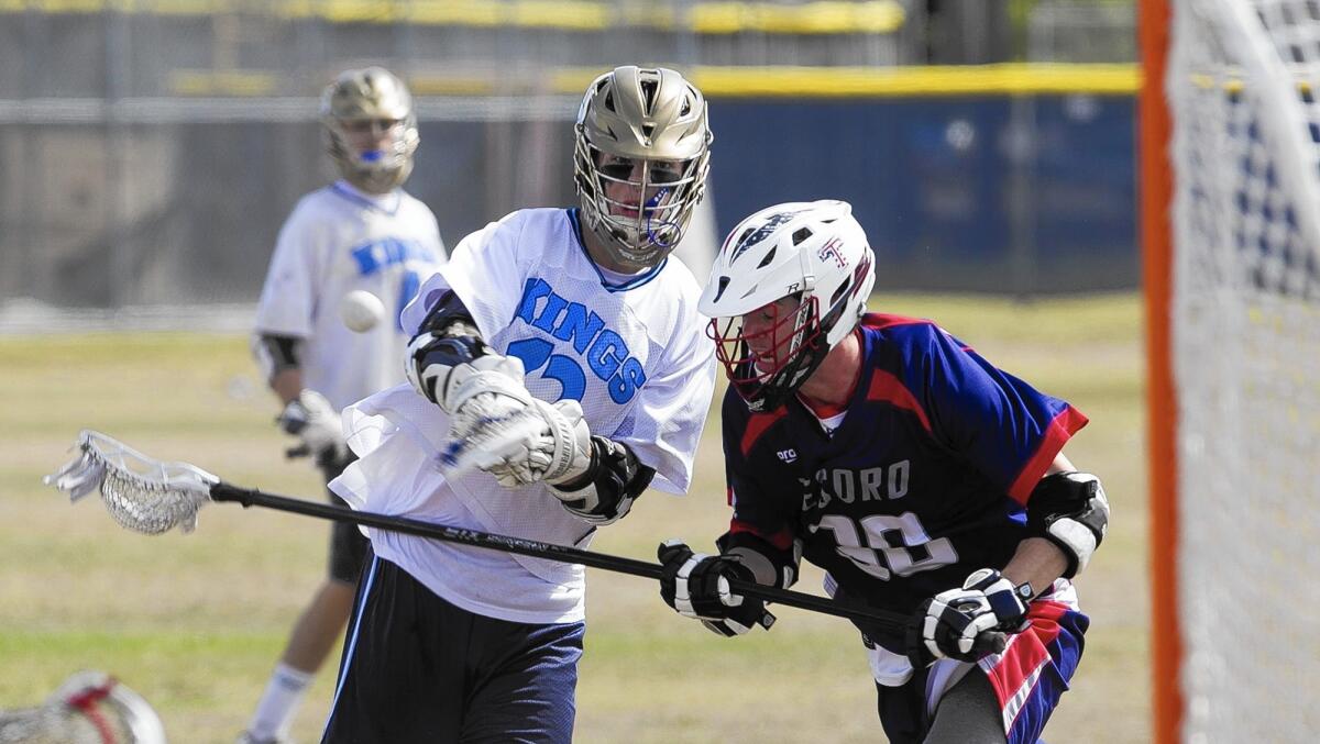 Corona del Mar High's Stephen Von der Ahe takes a shot against Tesoro's Riley McQuaid in a quarterfinal of the U.S. Lacrosse Southern Section South Division playoffs on Thursday.