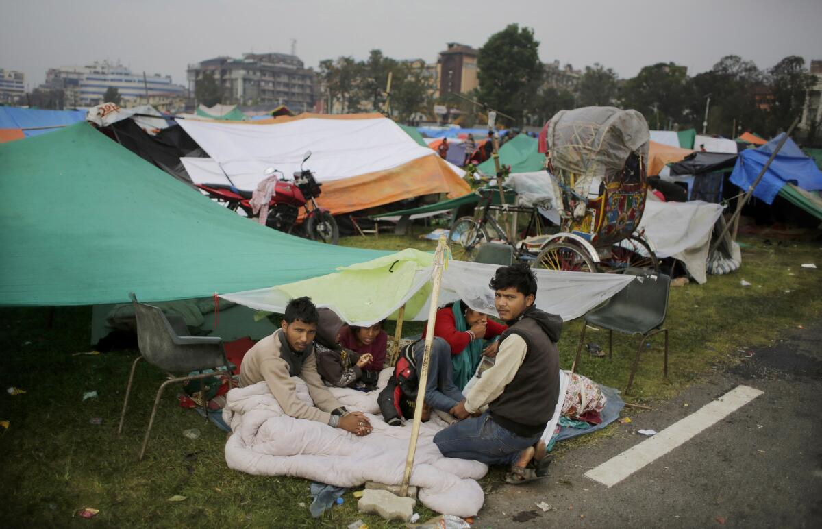 Survivors of Saturday's earthquake wake up Tuesday after sleeping outside over fears of aftershocks in Kathmandu, Nepal. More than 3,700 have died in the quake.