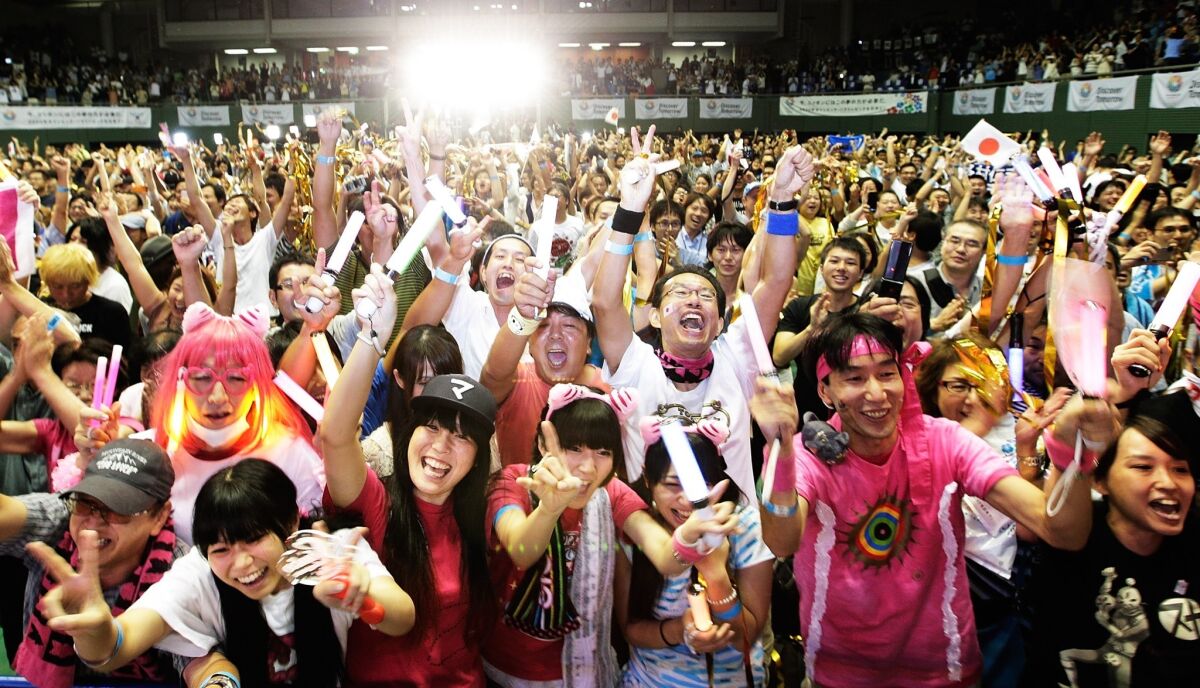 Supporters of Tokyo's Olympic bid celebrate Saturday after the International Olympic Committee selected the Japanese city to host the 2020 Summer Olympic Games.