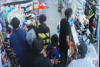 Surveillance footage of seven youngsters, who appear to ransack a 7-Eleven store on Wilshire Boulevard on July 12.