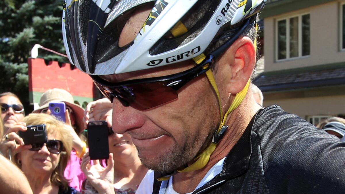 A judge has rejected a motion filed by disgraced cyclist Lance Armstrong, shown in 2012, to have a government lawsuit against him dismissed.