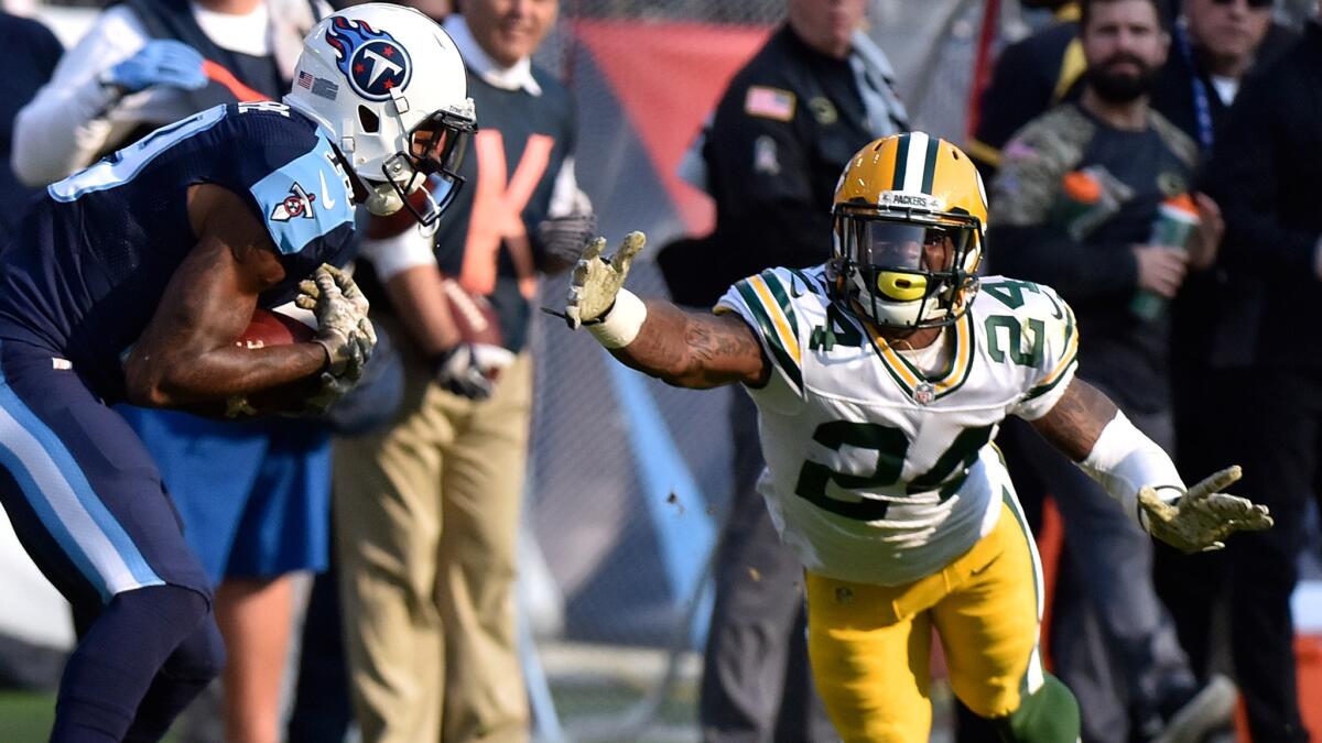 Packers cornerback Quinten Rollins dives to try to break up a touchdown pass to titans receiver Tajae Sharpe during a game Nov. 13.