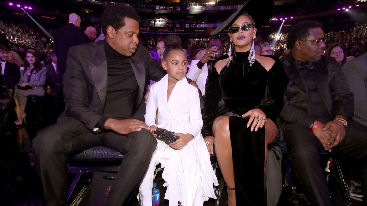 Even though half her face was obscured by cat-eye sunnies, Beyoncé’s glam slayed, per usual, with braids and a statement lip in bold lilac. Here she's seen at the Grammys with her husband, Jay-Z, and their daughter, Blue Ivy Carter.