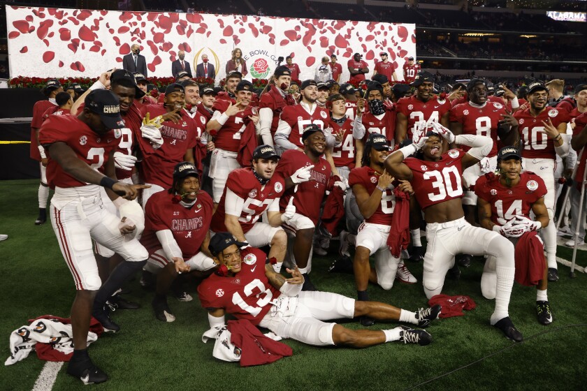 Alabama players celebrate their 31-14 win against Notre Dame in the Rose Bowl NCAA college football game in Arlington, Texas, Friday, Jan. 1, 2021. (AP Photo/Michael Ainsworth)