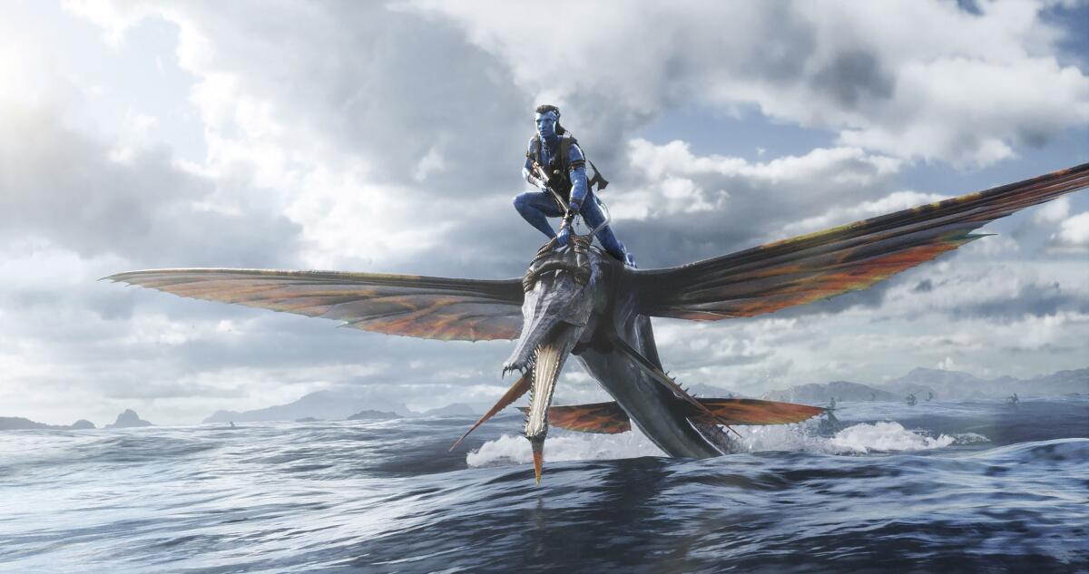 A computer-generated blue man riding a computer-generated winged animal over a body of water.
