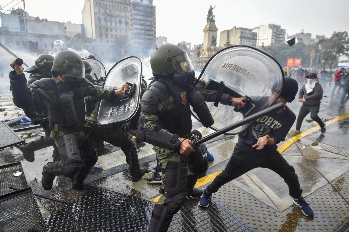 Anti-government protesters clash with police outside Congress in Buenos Aires.