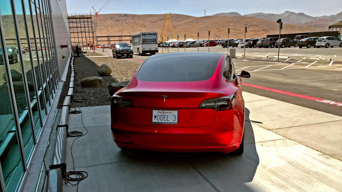 A Model 3 mockup outside Tesla's battery factory near Reno.