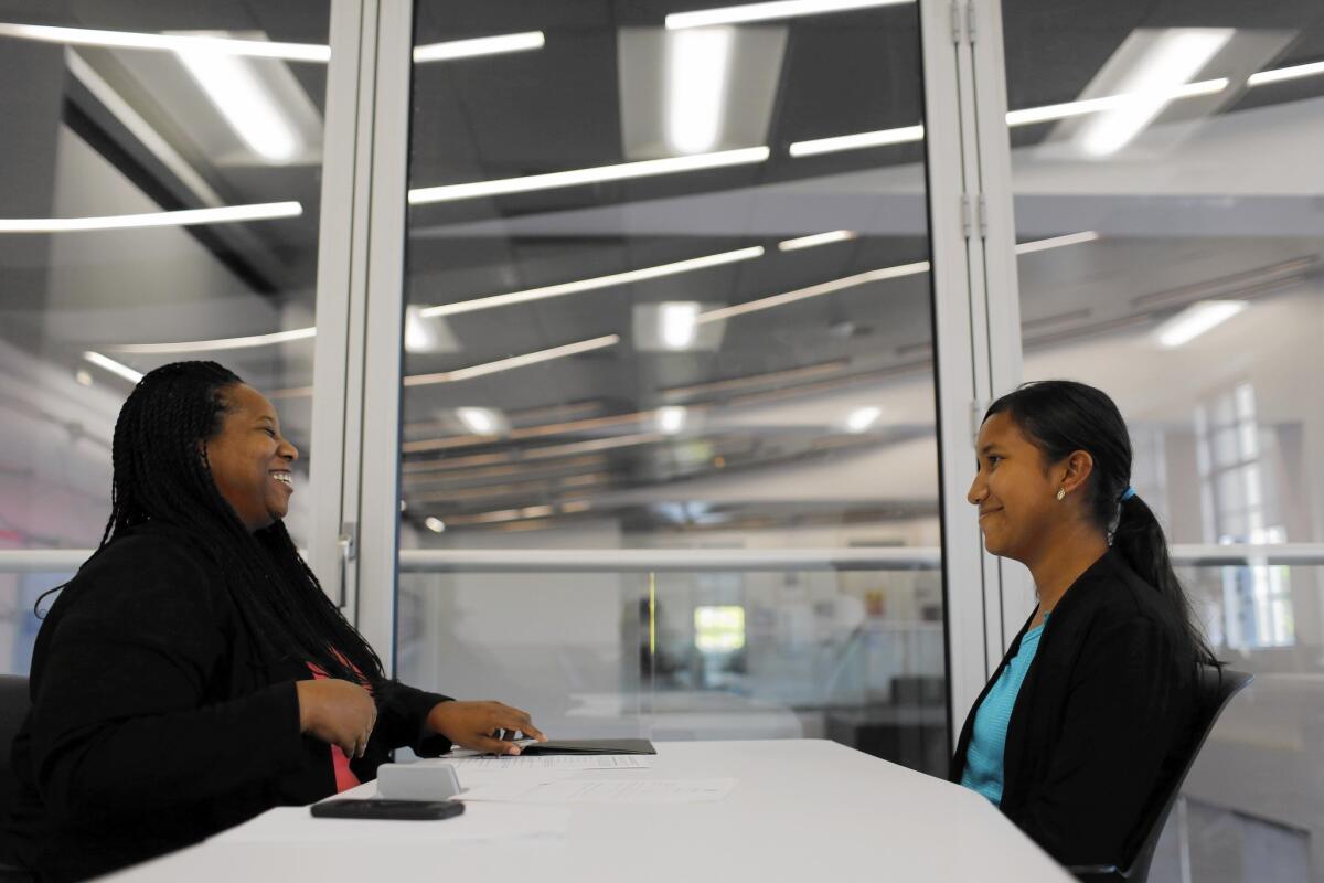 A Better Chance held a fair Sunday at Occidental College to help students navigate the prep school process. Above, Ashley Alvarez, 13, right, participates in a mock interview with alumna Leslie Poston.