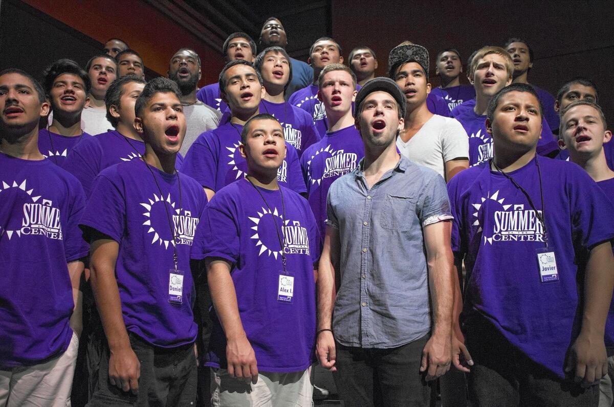 Teens from Orange County and staff members rehearse a theme song from the film "The Sound of Music" during a Summer at the Center program on Wednesday in the Samueli Theatre at Segerstrom Center for the Arts in Costa Mesa.