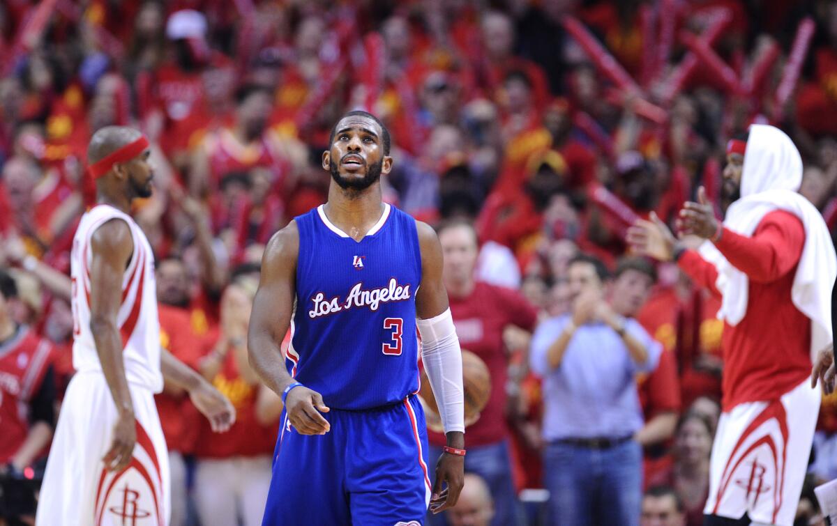 The Clippers' Chris Paul walks off the court during a timeout in Game 7 of the playoff series against the Houston Rockets on May 17.