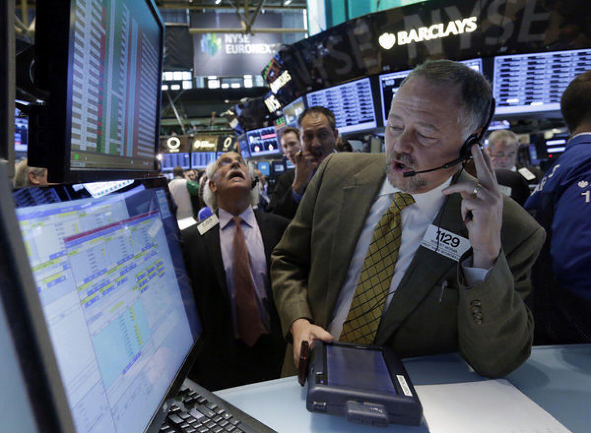Trader Robert Moran works on the floor of the New York Stock Exchange.