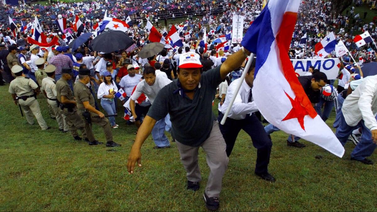Panamanians take over the hill at the Panama Canal Administration Building at the canal transfer ceremony in Panama City on Dec. 31, 1999.