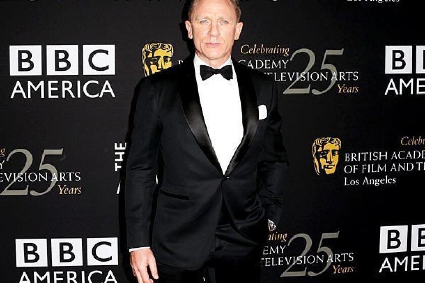 Daniel Craig arrives at the BAFTA Britannia Awards 2012, where he accepted British artist of the year from presenter Harrison Ford.