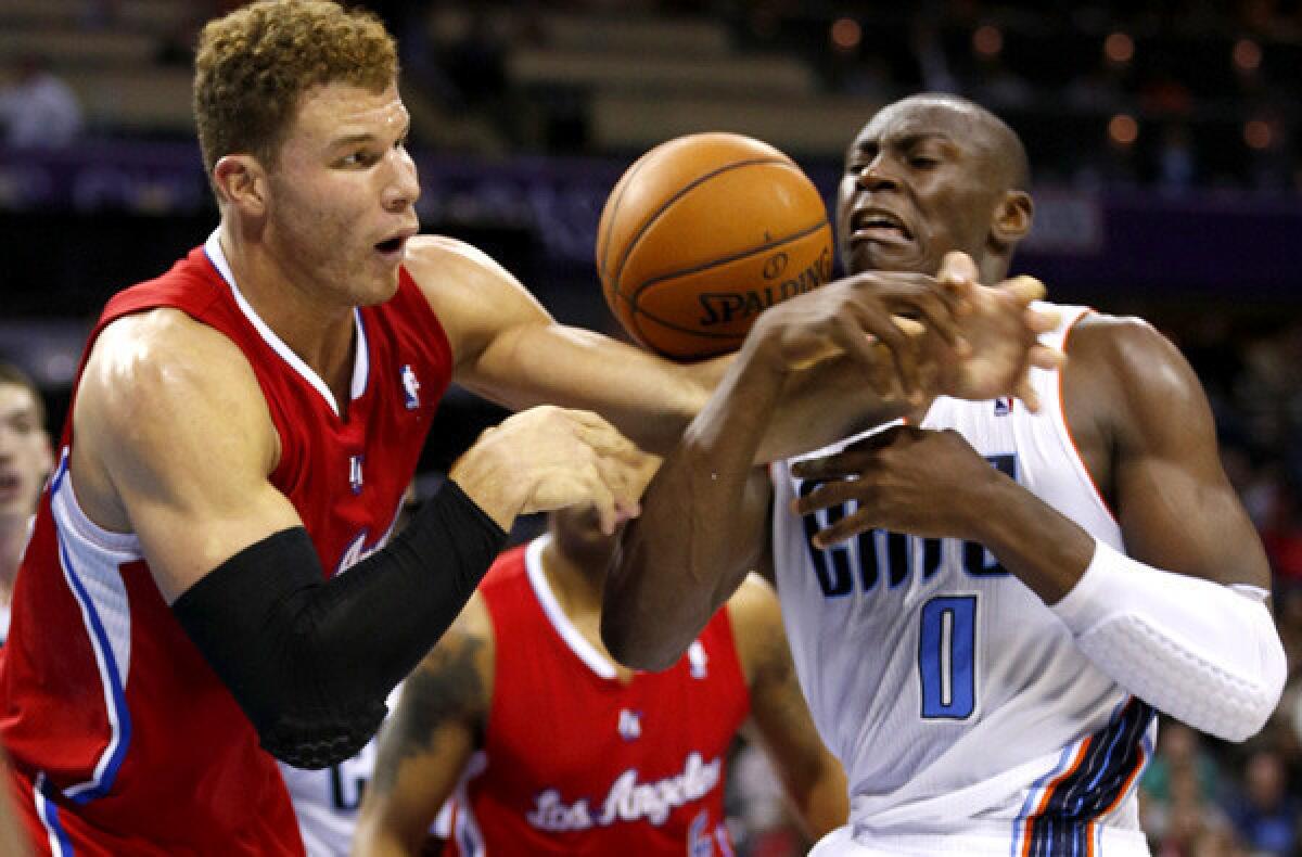 Clippers power forward Blake Griffin Bobcats center Bismack Biyombo battle for a rebound during a game last season.
