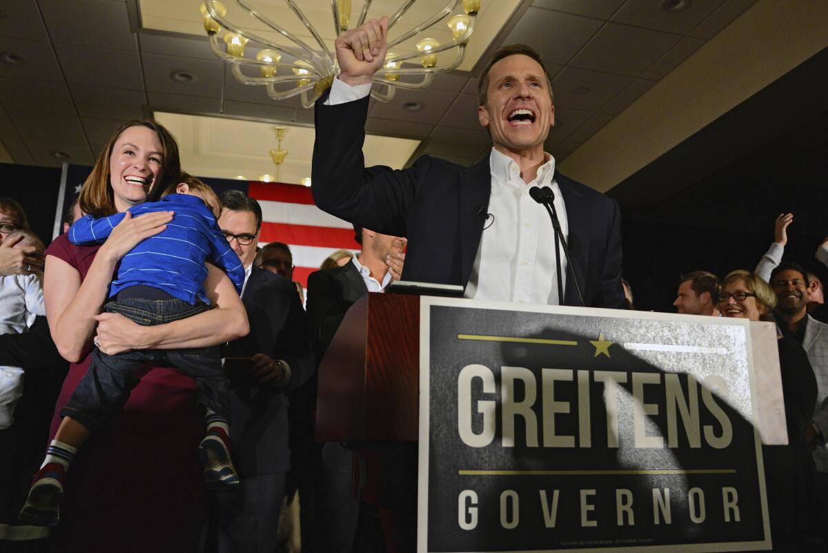 FILE - Missouri Republican Governor-elect Eric Greitens delivers a victory speech along side his wife Sheena and son Joshua on Tuesday, Nov. 8, 2016, in Chesterfield, Mo. The judge in the child custody case involving the former Missouri governor ruled that it should move to Texas because his two sons now spend most of their time there, and to better protect the boys from public scrutiny, according to a court document obtained Thursday, Sept. 8, 2022, by The Associated Press. The ruling issued in August 2022 but sealed in Missouri also noted that contrary to allegations levied by Sheena Greitens, there was “no pattern of domestic violence by either Mother or Father.” (AP Photo/Jeff Curry, File)