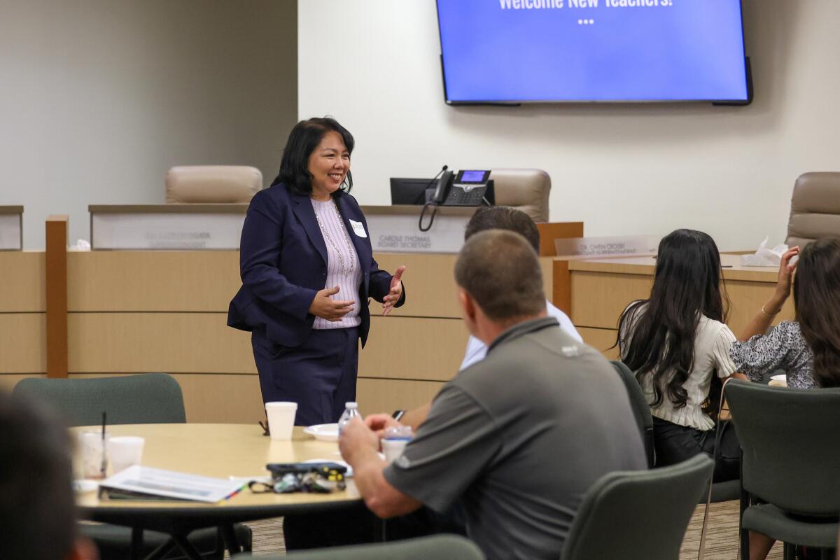 Huntington Beach Union High School District Supt. Carolee Ogata speaks to the district's new teachers at a recent event.