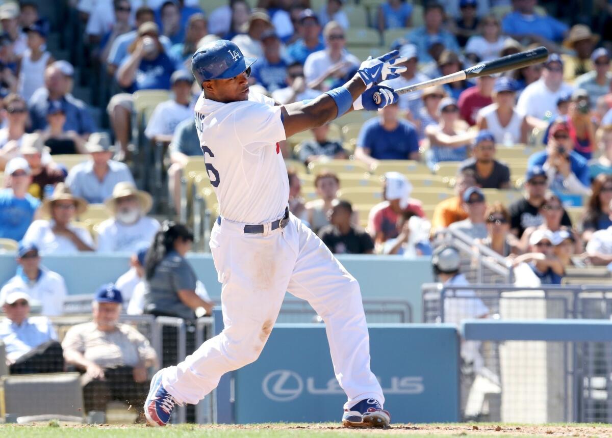 Dodgers outfielder Yasiel Puig hits a solo home run during the sixth inning of the Dodgers' 2-1 victory over the San Diego Padres on Sunday.