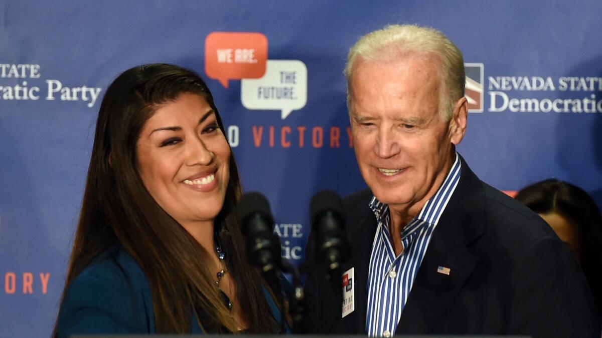 Lucy Flores, left, introduces Vice President Joe Biden at a get-out-the-vote rally Nov. 1, 2014, in Las Vegas, Nevada.