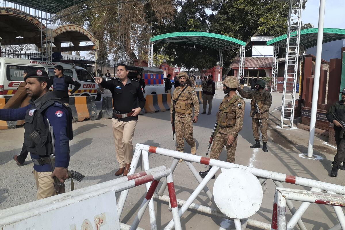Pakistani security forces near scene of suicide bombing