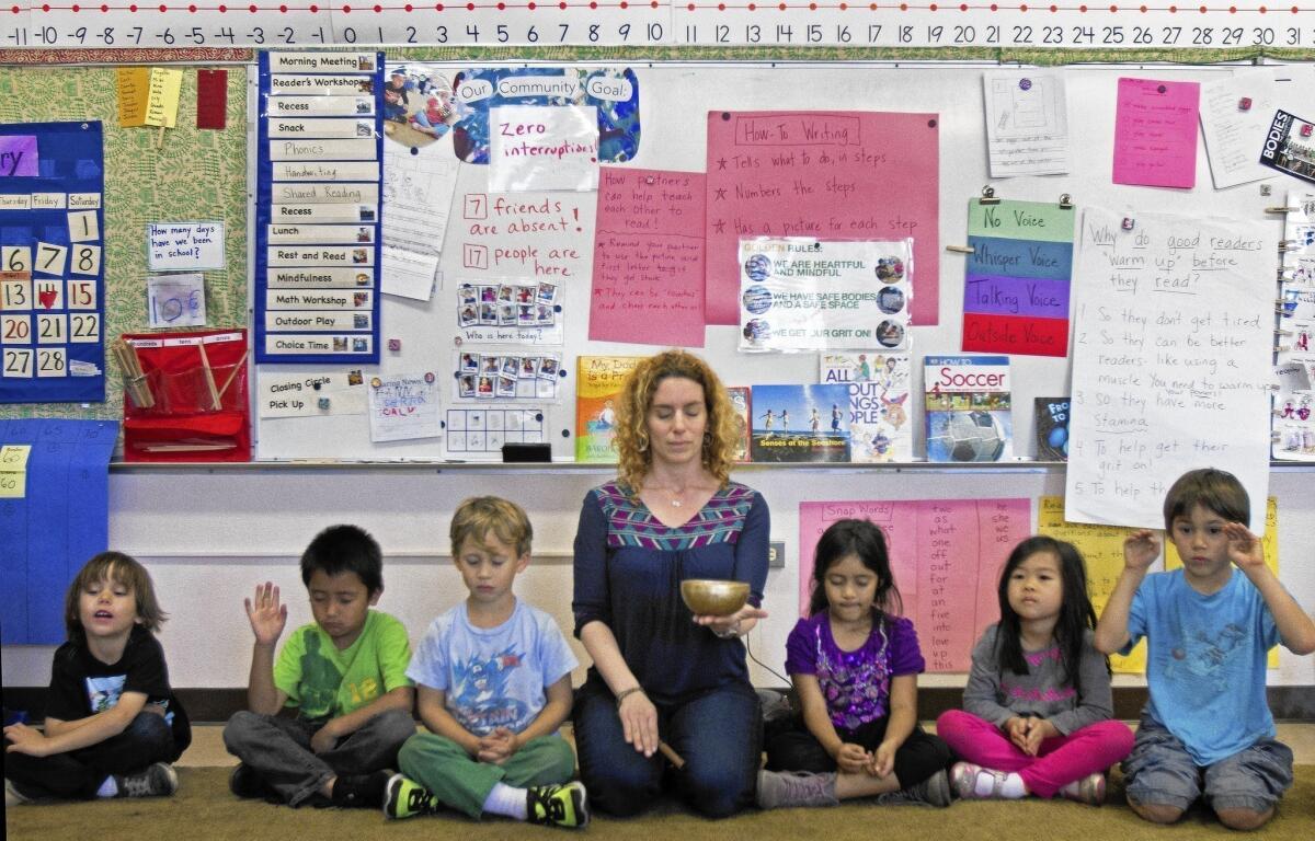 Sara Lev guides her kindergarteners through meditation at Citizens of the World, a charter school in Mar Vista.