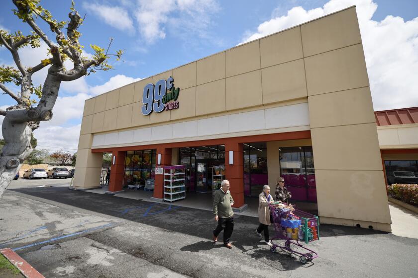 Huntington Beach, CA - April 05: Shoppers exit the 99 Cent Only store in Huntington Beach Friday, April 5, 2024. All 99 Cent Only stores will be closing soon. It is a store where many families go to food shop for less. (Allen J. Schaben / Los Angeles Times)