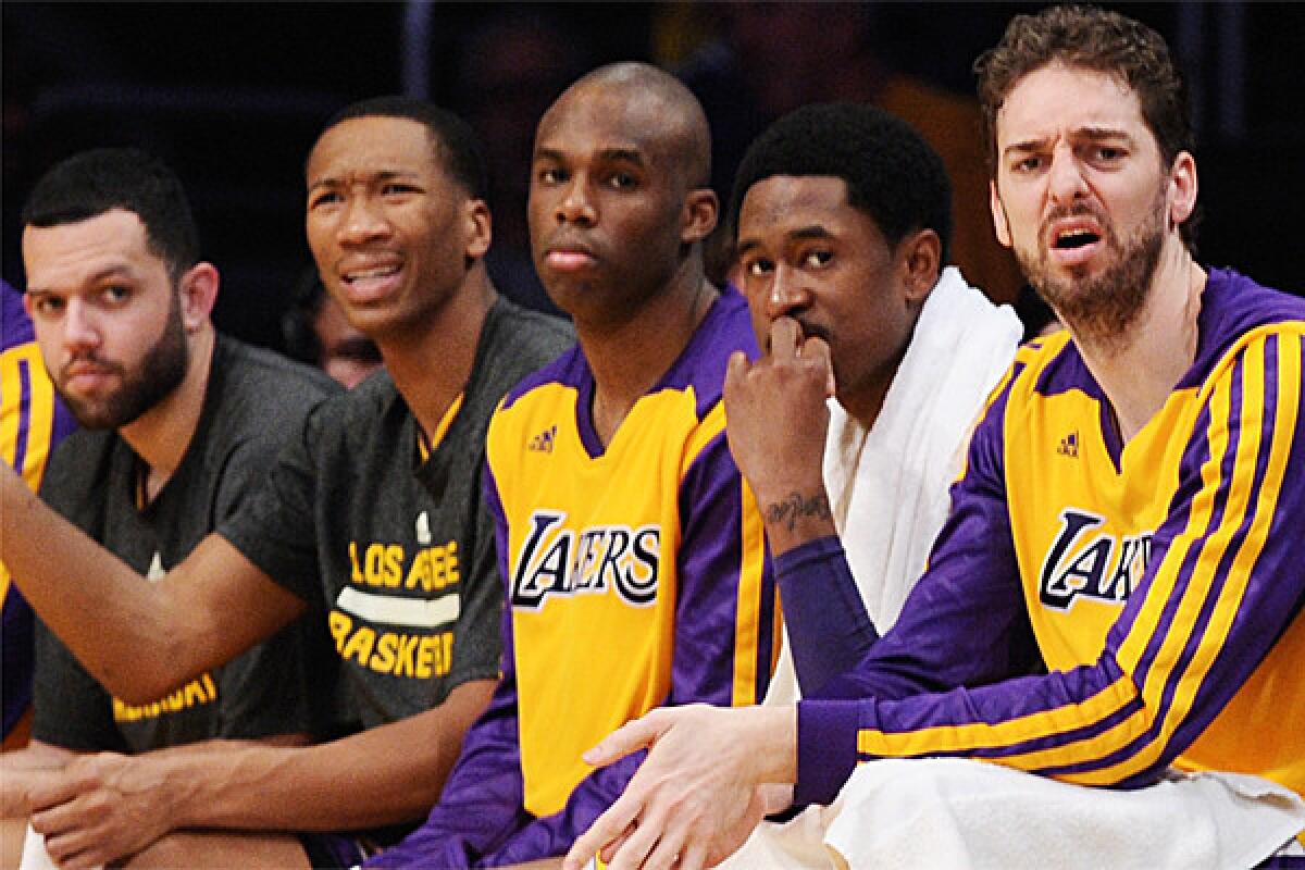Jordan Farmar, Wesley Johnson, Jodie Meeks, MarShon Brooks and Pau Gasol don't like what they see while sitting on the Lakers bench during a 142-94 loss to the Clippers last month.