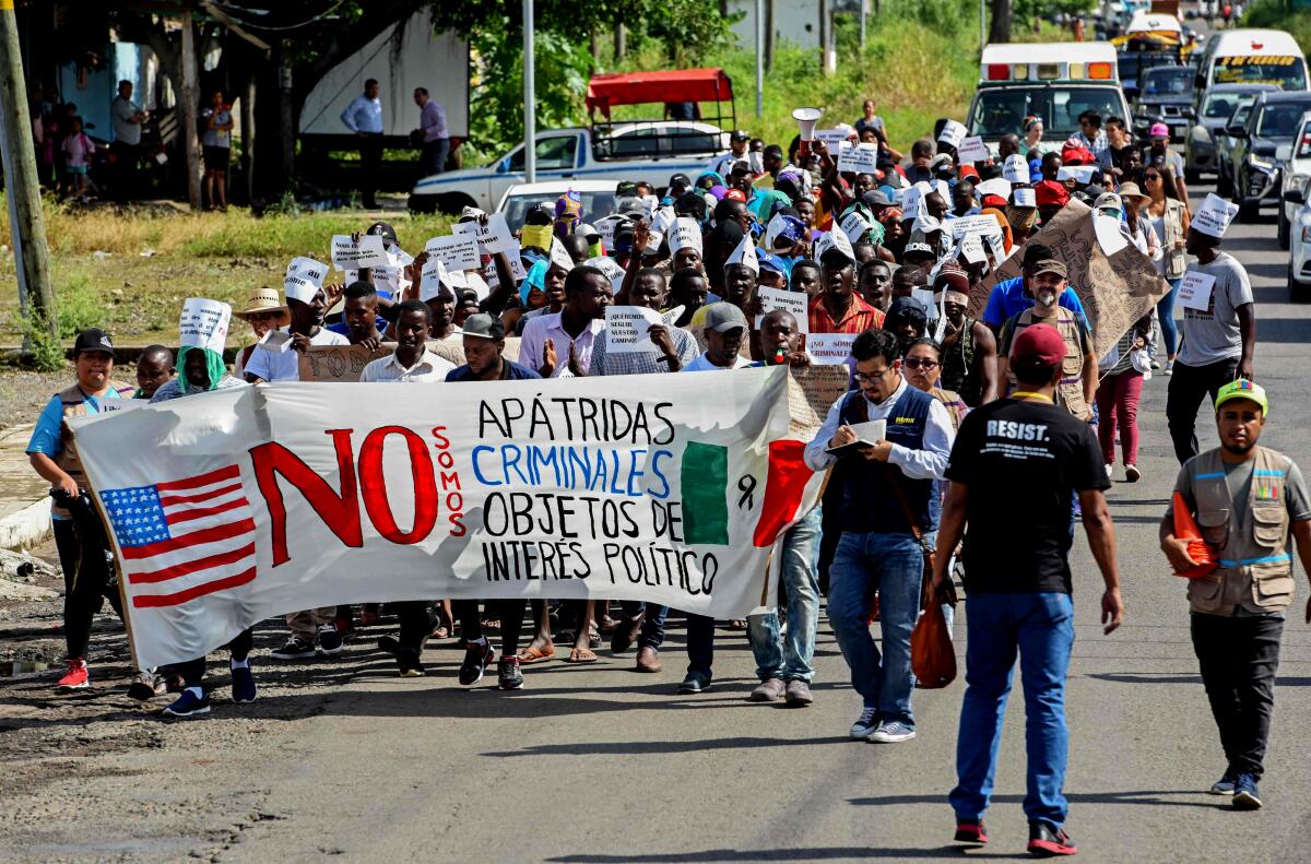 African migrants march to demand humanitarian visas that would enable them to cross Mexico on their way to the US, in Tapachula, Chiapas state, Mexico, in the border with Guatemala, on August 30, 2019.
