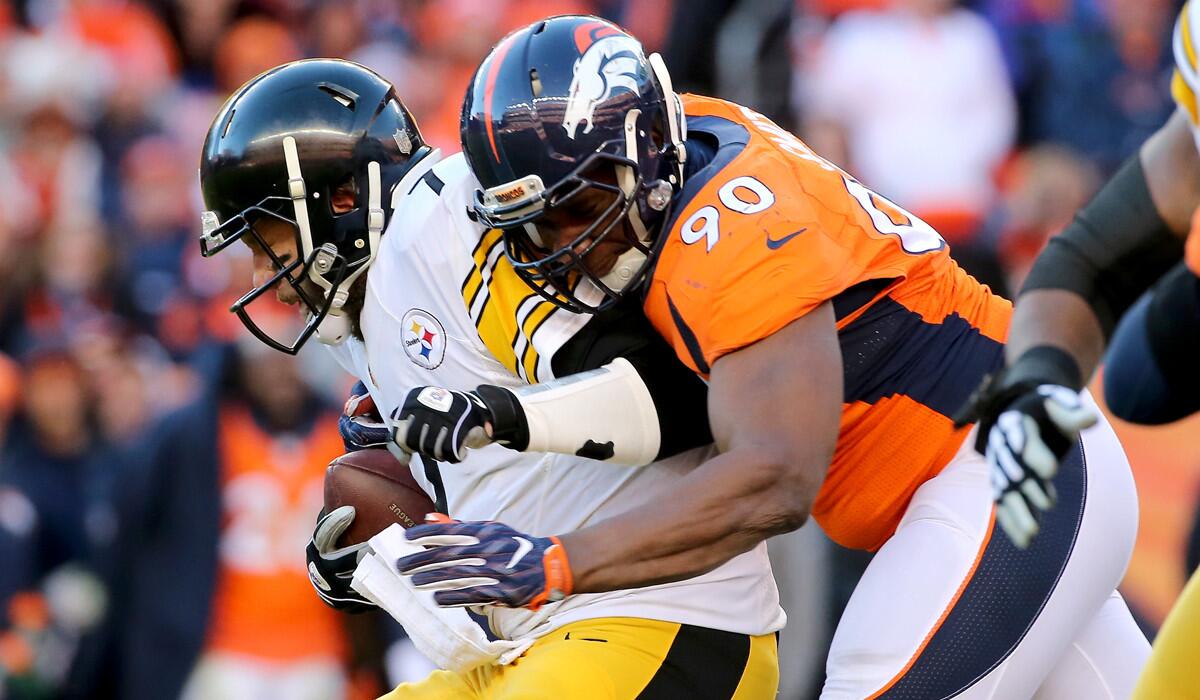 Pittsburgh Steelers quarterback Ben Roethlisberger, left, gets sacked by Denver Broncos' Antonio Smith during the AFC Divisional Playoff Game on Jan. 17.