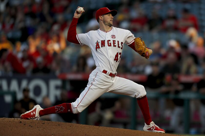 ANAHEIM, CALIF. - AUG. 13, 2019. Angels starter Griffin Canning delivers a pitch against the Pirates in the first inning Tuesday, Aug. 13, 2019, at Angels Stadium in Anaheim. (Luis Sinco/Los Angeles Times)