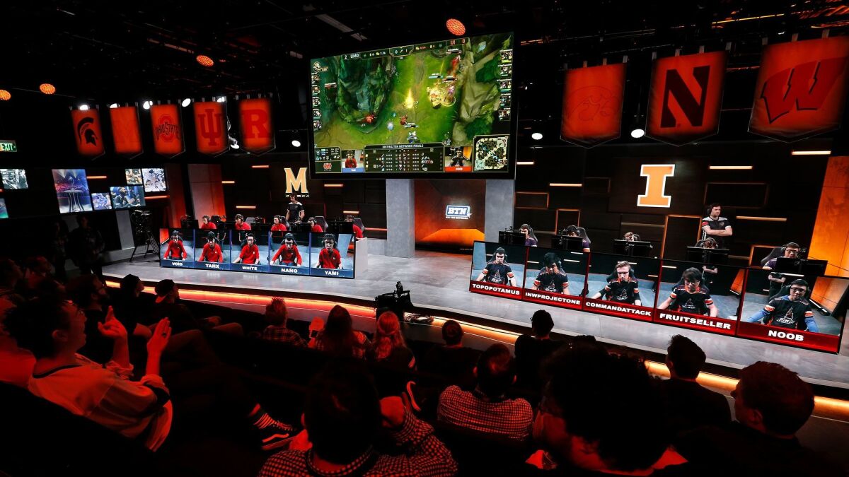 The audience watches a match between the University of Maryland, left, and the University of Illinois in the Big Ten Network "League of Legends" championship.