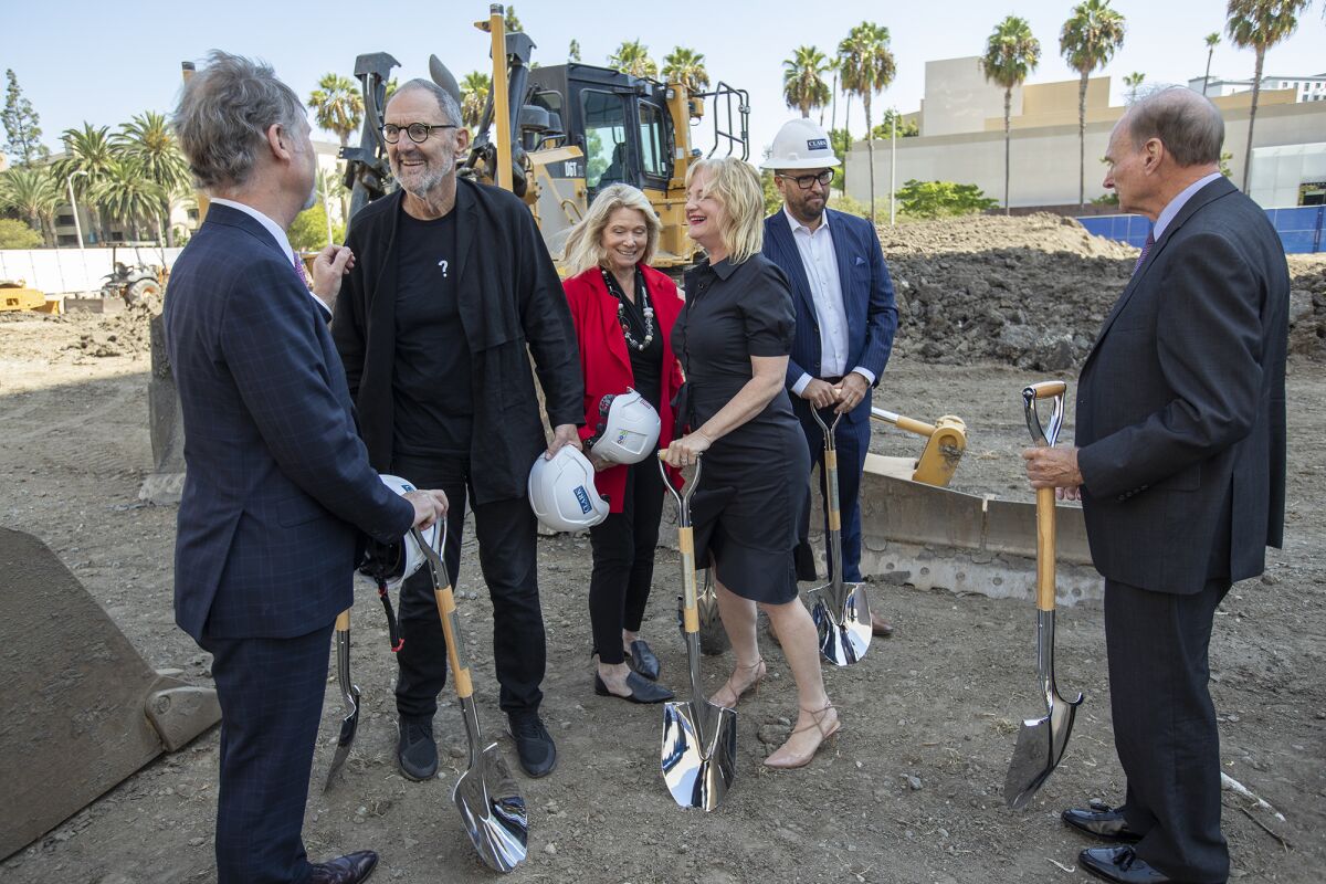 Anton Segerstrom, left, greets architect Thom Mayne.