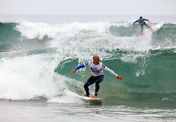 Kelly Slater competes in the quarterfinals of the U.S. Open of Surfing in Huntington Beach. He defeated Granger Larsen.