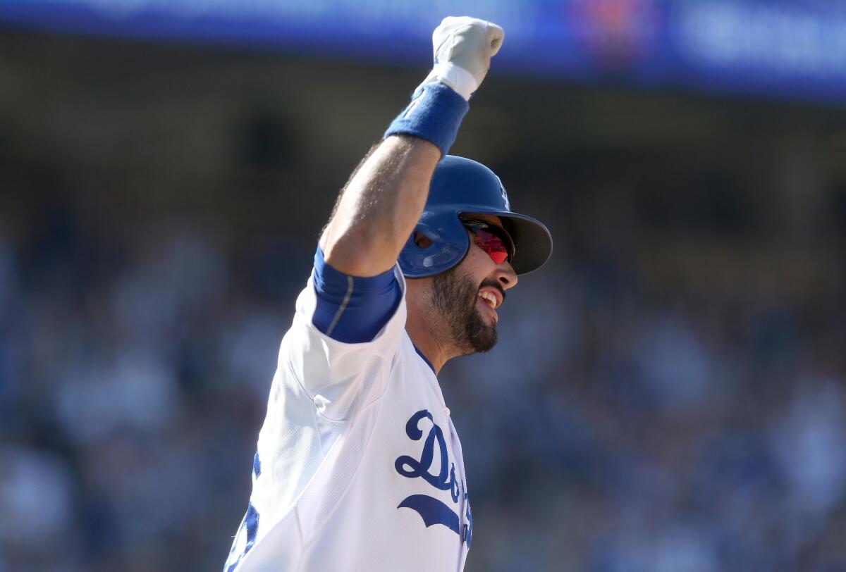 Dodgers outfielder Andre Ethier celebrates his walk-off two-run home run as it clears the fence. The Dodgers won 5-3 in 10 innings.
