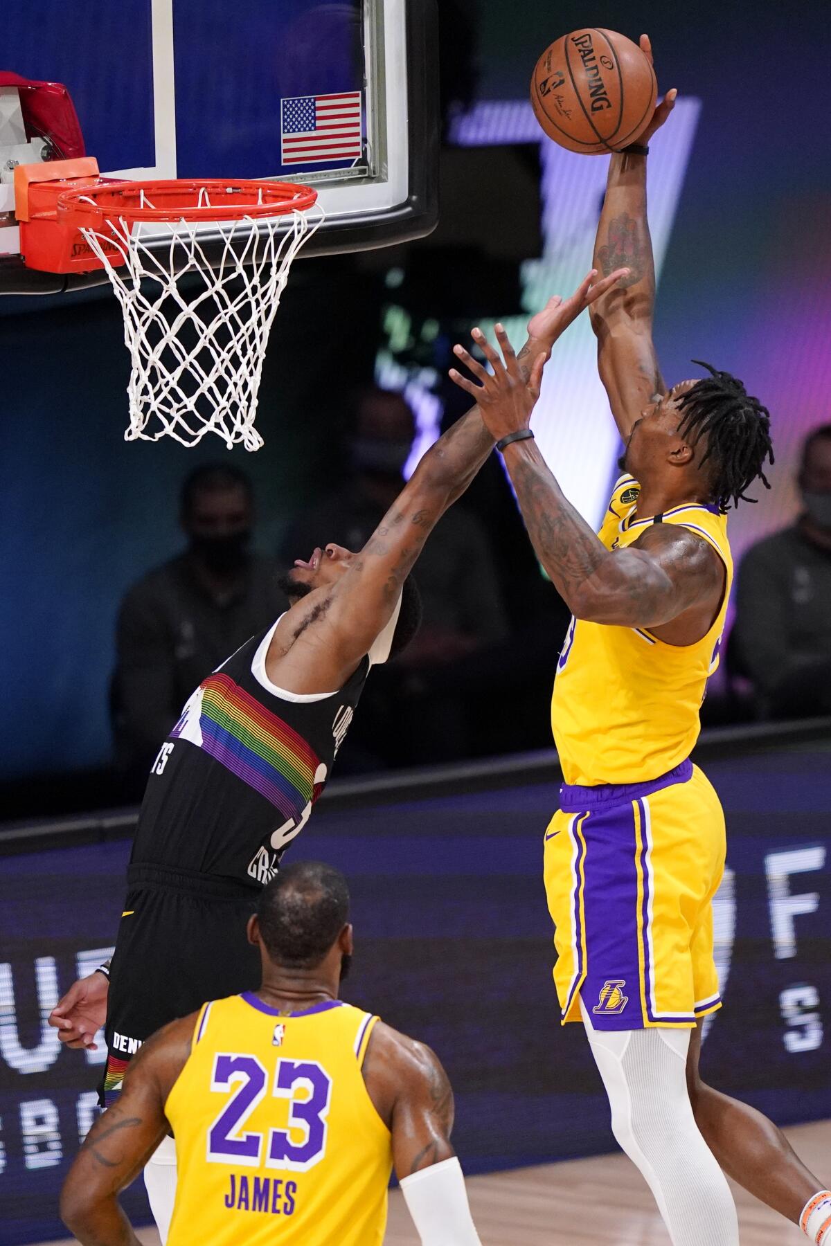 Lakers center Dwight Howard grabs a rebound against Nuggets forward Torrey Craig during Game 4.