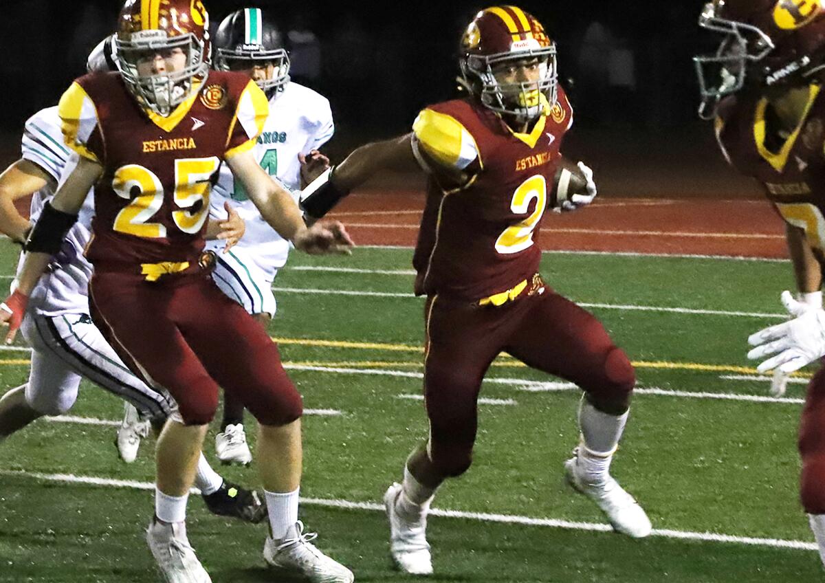 Estancia's Asa Davis (2) sees an opening against Costa Mesa in the Battle for the Bell football game on Friday.