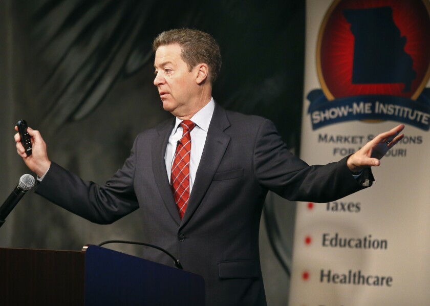 Kansas Gov. Sam Brownback tries to explain why people are leaving his state, during a conference last month in St. Louis.