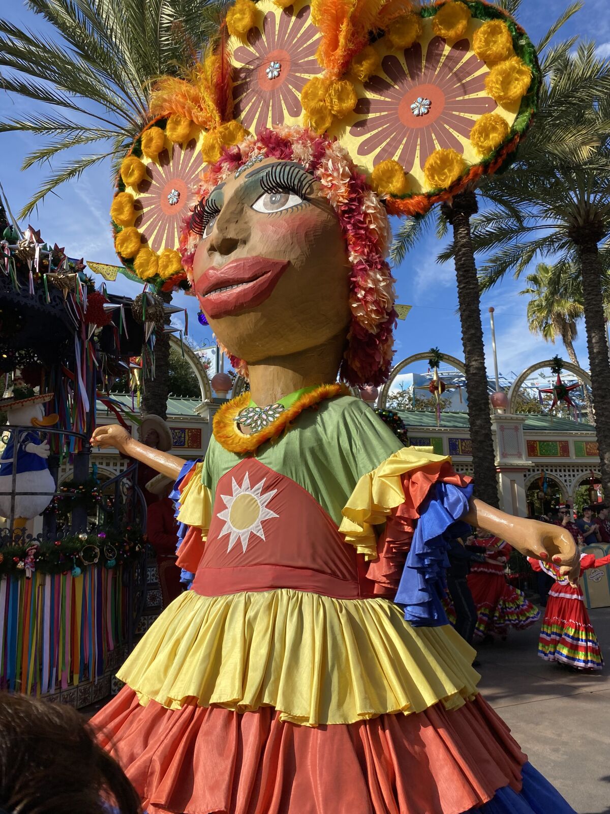 A giant mojiganga puppet at the “Disney ¡Viva Navidad!” street party at Disney’s California Adventure.