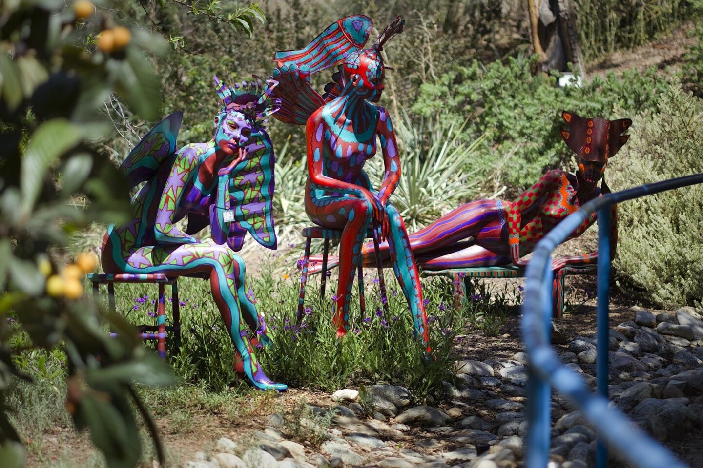 Fiberglass mannequins on stools by Dee Marcellus Cole during the Sculpture in the Garden by the Maloof Foundation for the Arts and Crafts in the large garden on the Maloof property in Alta Loma.