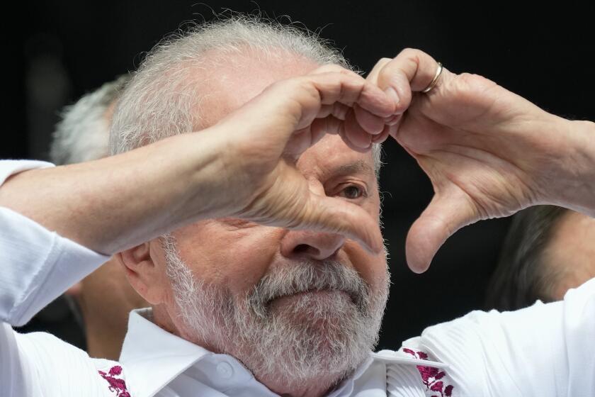 FILE - Brazilian President Luiz Inacio Lula da Silva gestures to supporters during a May Day rally in Sao Paulo, Brazil, Monday, May 1, 2023. Lula is scheduled to undergo hip replacement surgery Friday, Sept. 29. (AP Photo/Andre Penner, File)