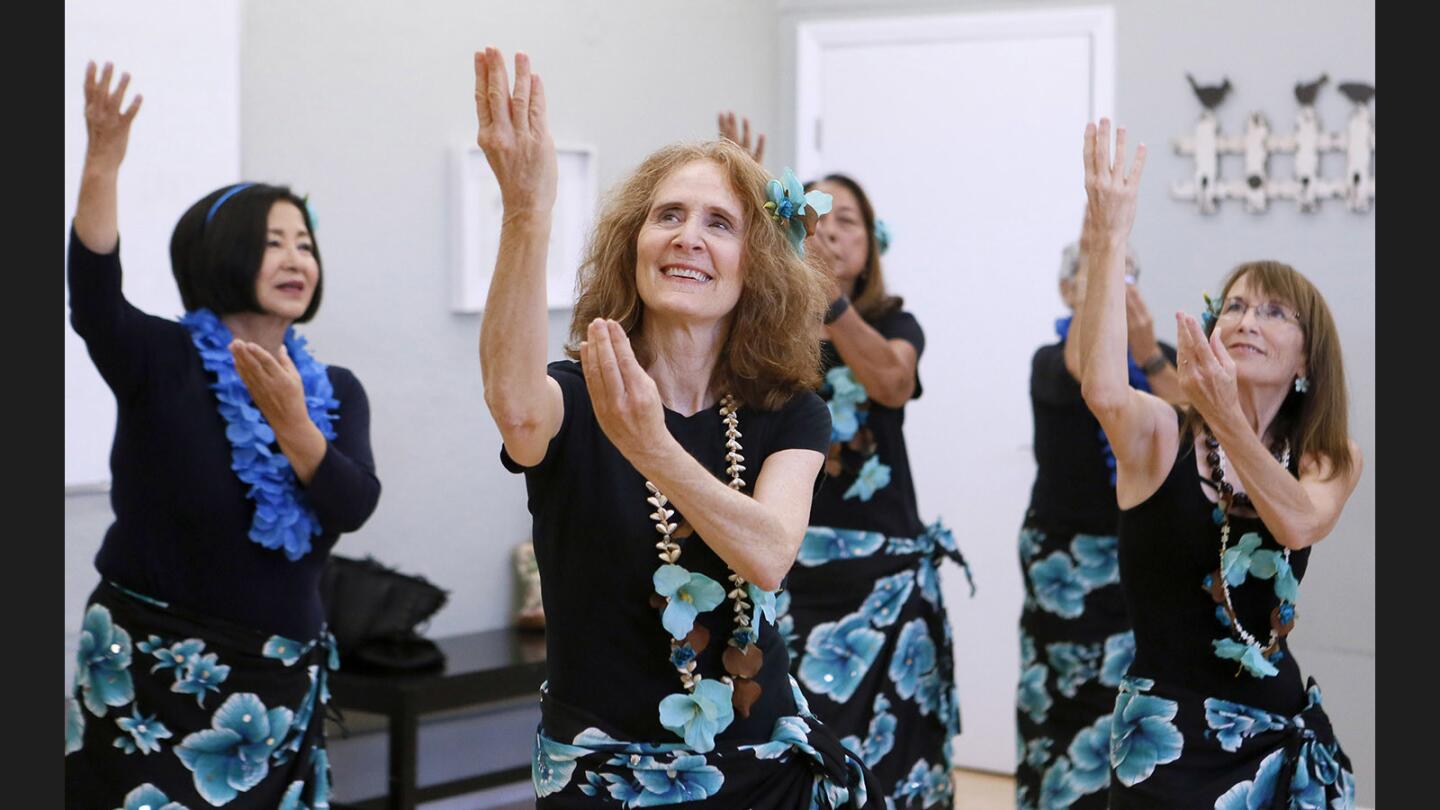 Michelle DeLawter, center, and others practice their hula dance at the Community Center of La Cañada Flintridge, in La Cañada Flintridge on Wednesday, June 28, 2017.